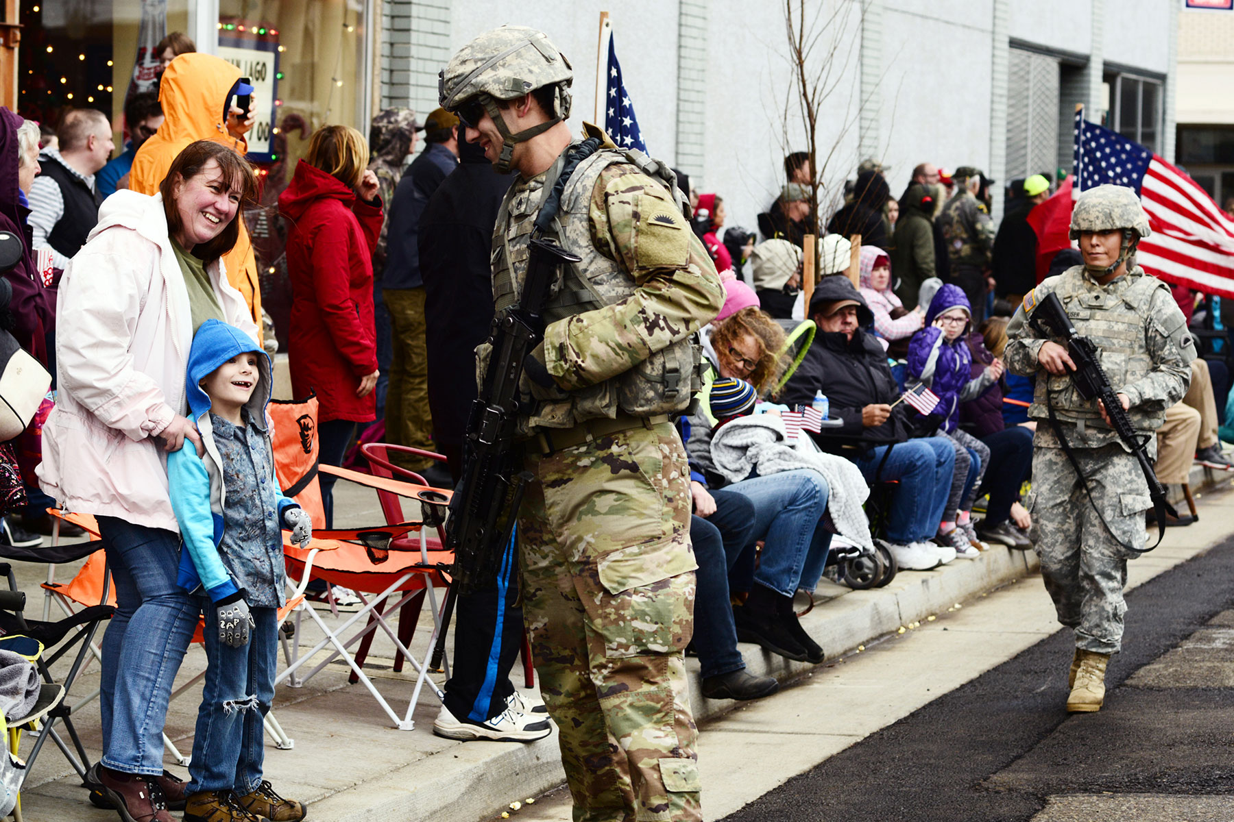 Oregon Army National Guard Soldiers with the 41st Infantry Brigade Combat Team greet spectators along the parade route during the annual Albany Veterans Day Parade, November 11, 2017, in Albany, Oregon.  (Oregon Military Department Public Affairs/April Davis)