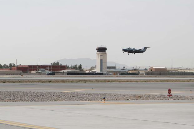 FILE -- An MC-12W Liberty departs Kandahar Airfield, March 20, 2014. (U.S. Air Force/Capt. Brian Wagner)