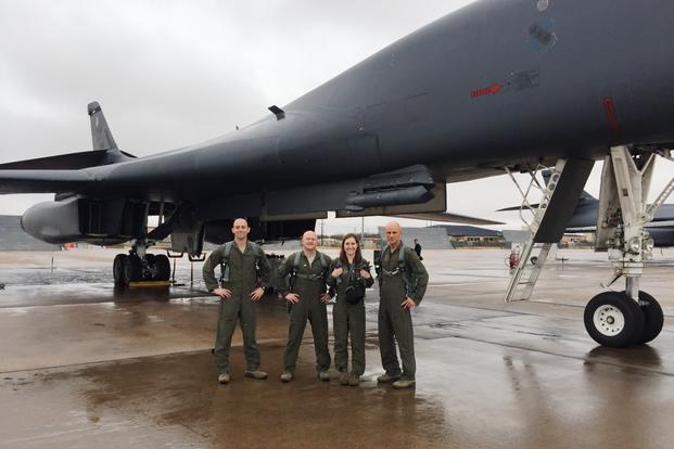 Military.com reporter Oriana Pawlyk with B-1 crew from left: 9th Bomb Squadron commander and weapons system officer Lt. Col. Erick Lord; Maj. Charles Kilchrist, B-1 pilot; and Capt. "Goa" Trafton. (Photo by 7th Bomb Wing/Dyess Public Affairs)