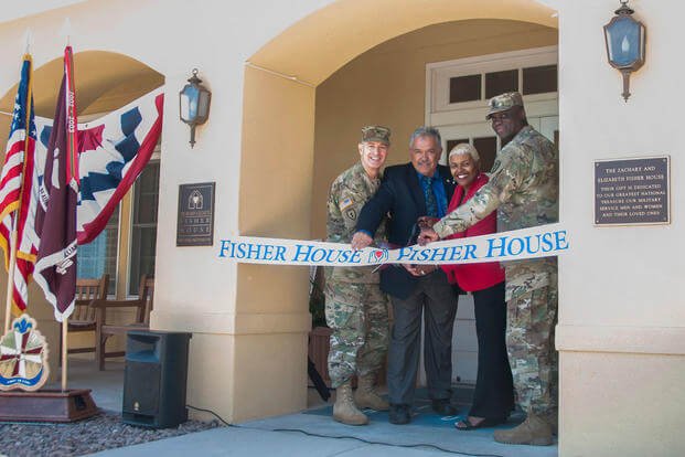Col. John A. Smyrski III, commander, William Beaumont Army Medical Center, John Ost III, di-rector, Army Fisher House Program, Alice Coleman, manager, WBAMC Fisher House, and Command Sgt. Maj. Donald George, command sergeant major, WBAMC, cut the ribbon to the newly renovated Fisher House on the WBAMC campus, May 12, 2017. (William Beaumont Army Medical Center Public Affairs Office/Marcy Sanchez)