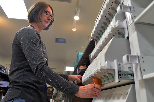 Jessica Gaines, 341st Medical Support Squadron pharmacy technician, fills a prescription using an automated drug dispensing cabinet Aug. 14, 2017, at Malmstrom Air Force Base, Montana.  (U.S. Air Force/Daniel Brosam)