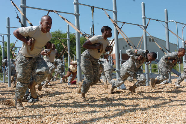 Soldiers work with the TRX suspension system.