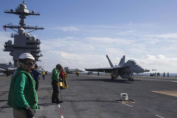 An F/A-18F Super Hornet, assigned to the "Swordsmen" of Strike Fighter Squadron (VFA) 32, approaches the USS Gerald R. Ford's (CVN 78) Electromagnetic Aircraft Launching System (EMALS) during flight deck operations in the Atlantic Ocean on Nov. 6, 2017. (U.S. Navy photo by Mass Communication Specialist 2nd Class Kristopher Ruiz)