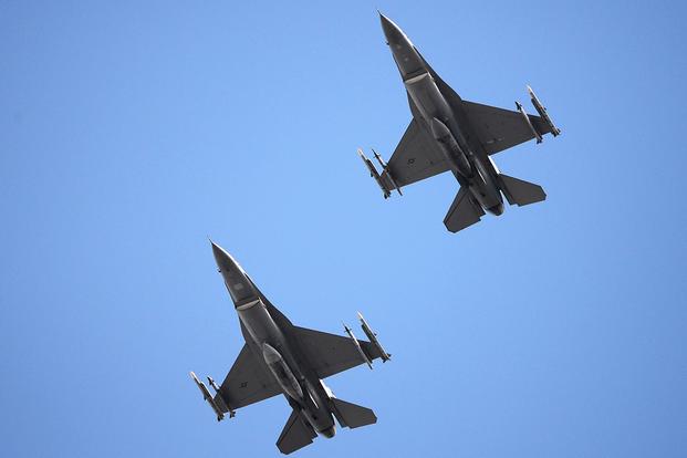 U.S. Air Force F-16C Fighting Falcons fly over the Air Dominance Center in Savannah, Georgia, March 12, 2018. (U.S. Air National Guard/Senior Airman Cristina J. Allen)