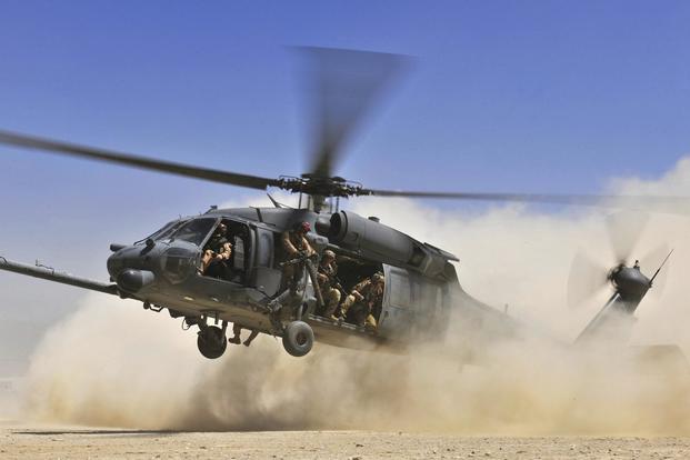An HH-60G Pave Hawk helicopter carrying combat search and rescue Airmen approaches a landing zone during an exercise at Bagram Airfield, Afghanistan, Aug. 21. 2010. (U.S. Air Force/Staff Sgt. Christopher Boitz)