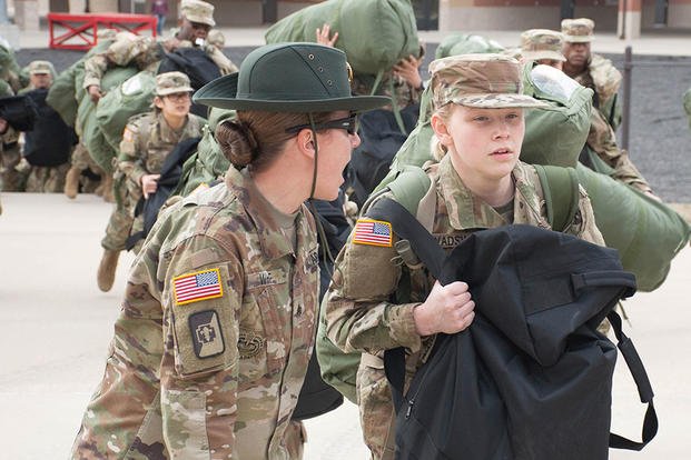 A U.S. Army drill sergeant corrects a recruit during her first day of training at Fort Leonard Wood, Mo., Jan. 31, 2017. (U.S. Army photo/Stephen Standifird)
