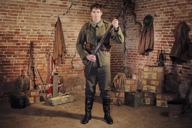 Historian Dan Snow models a German army uniform from World War I in a BBC segment. (YouTube/BBC)
