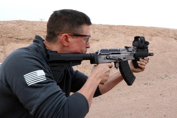 Dan Blackburn, design engineer and owner of United Defense Corporation, firing his new AK103X series of custom-built, hybrid AK rifles and carbine at the SHOT Show 2019 industry day at the range. (Matthew Cox/Staff)