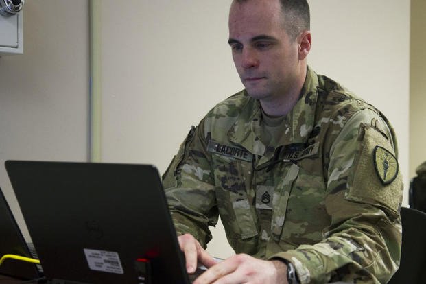 Staff Sgt. Samuel LaCorte of Indianapolis, Ind. the Indiana Joint Force Headquarters, Headquarters detachment studies his computer screen during the training portion of Cyber Shield 2019 at Camp Atterbury, Ind., April 8, 2019. (National Guard photo/William Phelps)