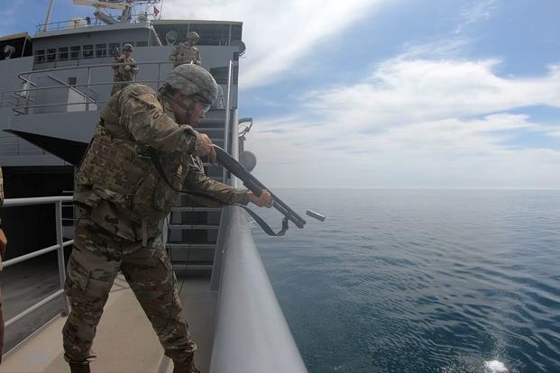 A crew member of the Army’s Logistics Support Vessel Maj. Gen. Charles P. Gross (LSV 5) shoots a Mossberg 12 gauge shotgun during range qualifications on the northern Arabian Gulf, March 13, 2019.  (Veronica McNabb/U.S. Army National Guard)