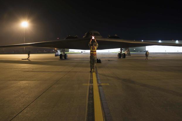 Airman 1st Class Austin Sawchuk, a crew chief assigned to the 509th Bomb Wing, marshals in a B-2 Spirit on the flight line at Royal Air Base Fairford, England, on Aug. 27, 2019. A Bomber Task Force deployment of the stealth bomber aircraft, airmen and support equipment from the 509th BW at Whiteman Air Force Base, Missouri, arrived in the U.S. European Command area of operations for a deployment to conduct theater integration and flying training.  (U.S. Air Force photo by Staff Sgt. Kayla White)