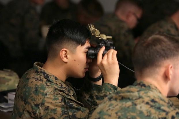 A Marine peers through the lens of the Squad Binocular Night Vision Goggles during new equipment training in December 2018 at Camp Lejeune, North Carolina. The Marine Corps awarded a contract Sept. 6, 2019, to procure approximately 14,000 systems. (Photo: Marine Corps)