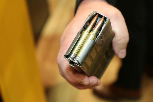This is Sig Sauer’s design for the Next Generation Squad Weapon’s 6.8mm cartridge that features  a stainless steel base to save weight. (Military.com/Matthew Cox)