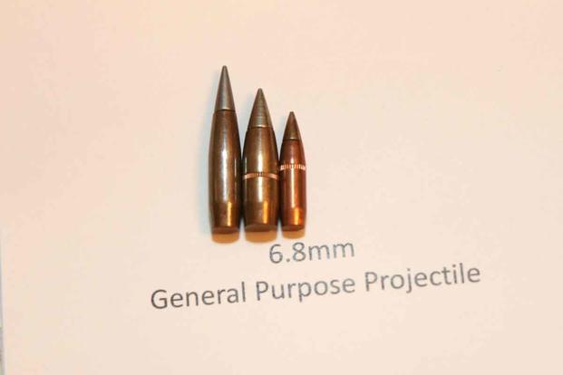 Army’s 6.8mm General Purpose Projectile (Left) compared to the Army’s current M80A1 Enhanced Performance Round (Center) and the M855A1 Enhanced Performance Round from an Army Futures Command event in mid-July. (Military.com/Matthew Cox)