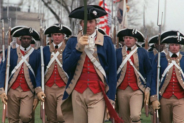 Ceremonial troops of the 3rd United States Infantry (The Old Guard), also known as the commander in CHIEF's Guard, salute distinguished guests as they pass in review during the Cessation of Hostilities Bicentennial Celebration at the Pentagon River Plaza. (NARA)