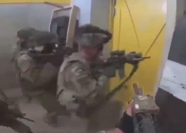 10th Mountain soldiers seen training in a shoot house with live ammo, pointing weapons at each other. (Screengrab via Instagram)