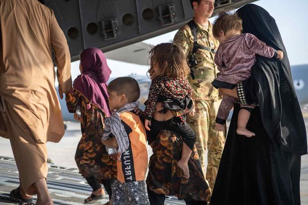 Passengers board a U.S. Air Force C-17 as part of Afghanistan evacuation