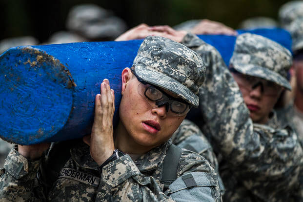 Soldiers at Fort Jackson carry a log to promote teamwork.