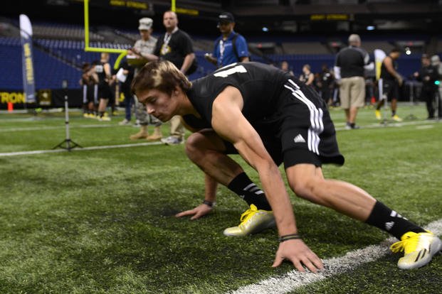 A player performs the timed shuttle run at the 2014 U.S. Army All-American Combine.