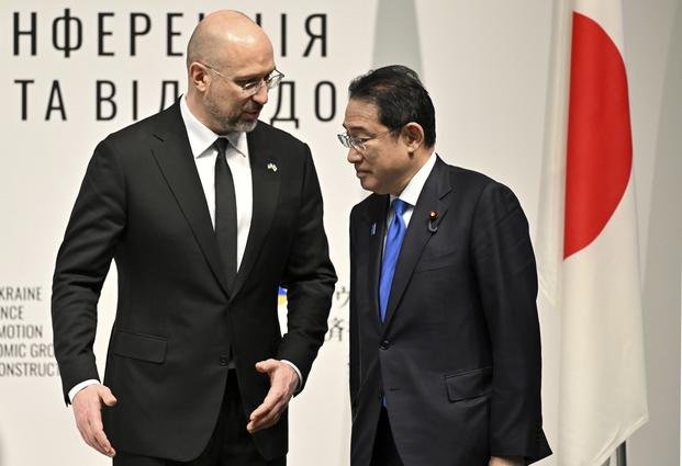 Ukraine's Prime Minister Denys Shmyhal speaks with Japanese Prime Minister Fumio Kishida