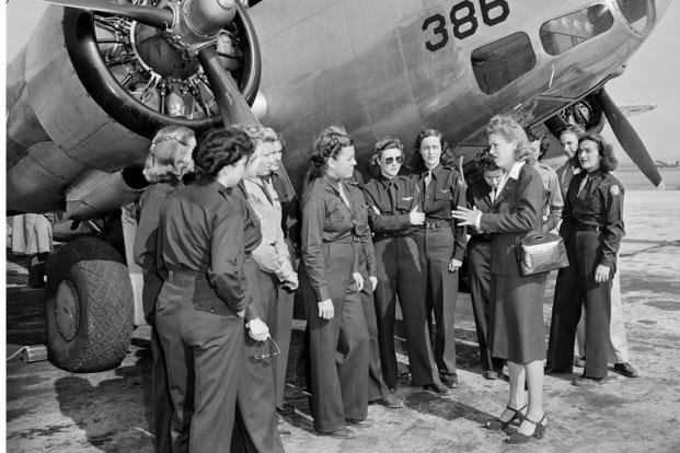 Members of the Women Airforce Service Pilots stand in front of an AT-10 plane at Camp Davis, N.C., Oct. 24, 1943. (AP Photo)