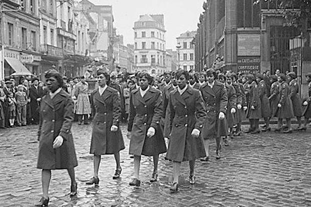 Women soldiers of the all-Black 6888th Central Postal Battalion participate in a victory parade in Rouen, France in May 1945. (U.S. Army)