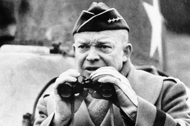 General Dwight D. Eisenhower, commander in chief of Allied forces organizing in Britain to invade Europe, lifts field glasses to his eyes to watch maneuvers somewhere in Britain, March 13, 1944. (AP Photo) General Dwight D. Eisenhower, commander in chief of Allied forces organizing in Britain to invade Europe, lifts field glasses to his eyes to watch maneuvers somewhere in Britain, March 13, 1944.