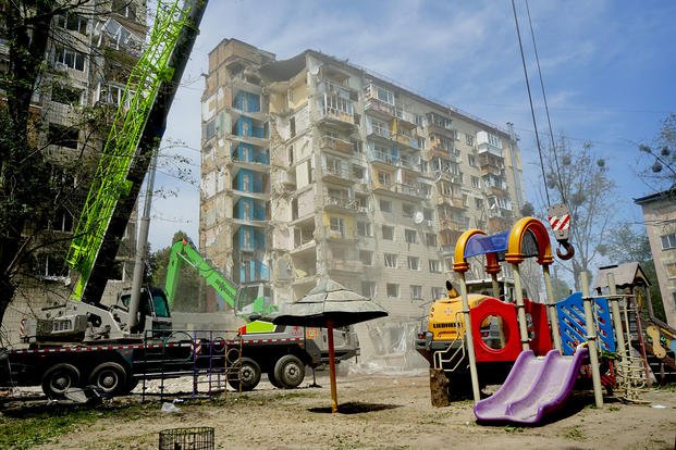 Rescue workers continue to sift through the rubble of a destroyed apartment in central Kyiv, Ukraine, hours after a Russian missile attack obliterated the building in the early morning of June 18, 2025, killing dozens of people. (Photo by Katie Livingstone for Military.com) Rescue workers continue to sift through the rubble of a destroyed apartment in central Kyiv, Ukraine