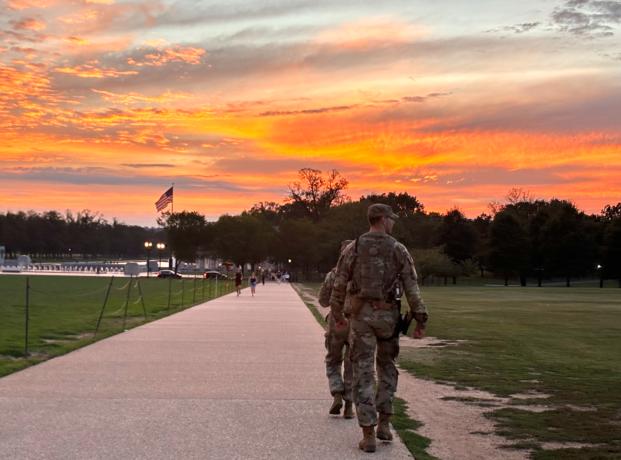 National Guard troops patrol the National Monument in Washington, D.C., as their deployment is extended through November. Photo by Bridget Craig National Guard troops patrol the National Monument in Washington, D.C., as their deployment is extended through November. Photo by Bridget Craig