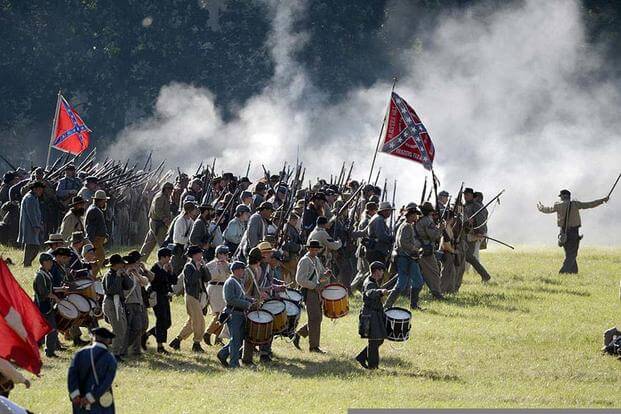Confederate soldier re-enactors charge to battle during the 150th anniversary of Gettysburg in Gettysburg, Pa., July 6, 2013. (DOD/EJ Hersom)
