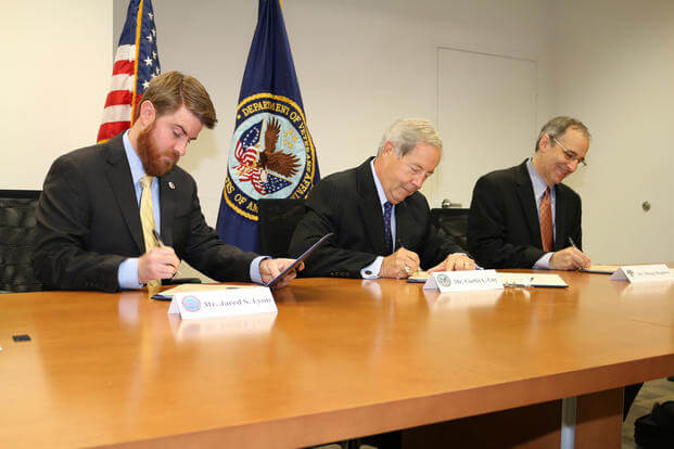 Representatives of SVA, VA, and NSC sign MOU to study GI Bill veteran records