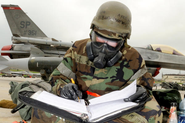 Airman sitting and studying.
