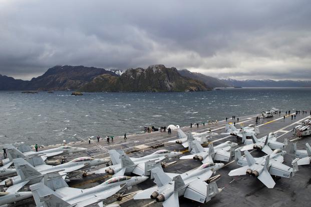 Sailors take photos on the flight deck as aircraft carrier USS George Washington (CVN 73) transits the Strait of Magellan on Nov. 1, 2015, as part of the exercise Southern Seas 2015. (U.S. Navy photo by Bryan Mai)