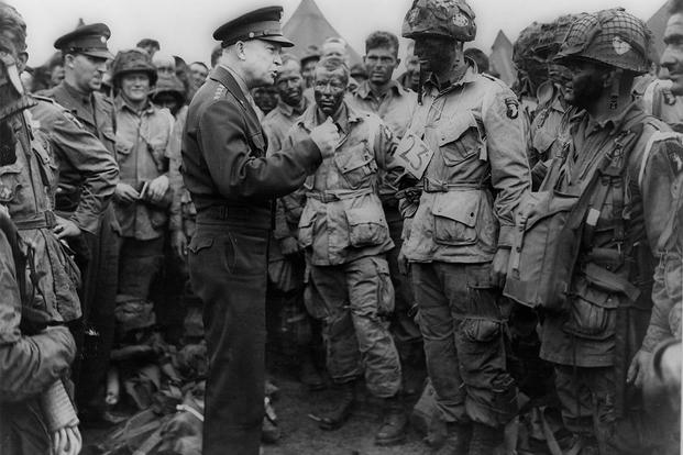 Gen. Dwight D. Eisenhower gives the order of the day, "Full victory - nothing else," to paratroopers in England, just before they boarded their airplanes to participate in the first assault in the invasion on June 6, 1944.