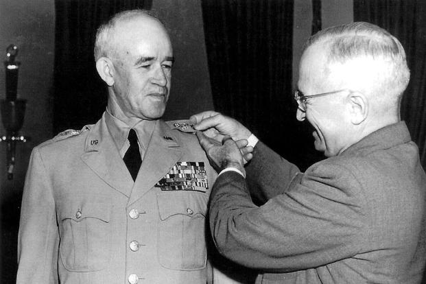 President Harry S. Truman promotes Gen. Omar Bradley to five-star rank.