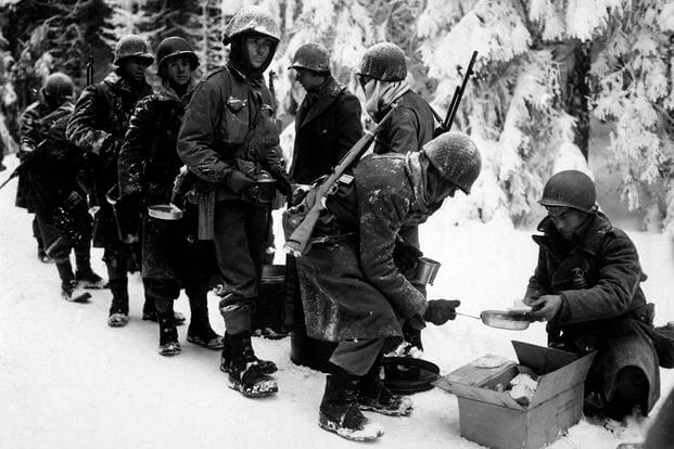 Chow is served to the 347th Infantry Regiment in, Belgium, January 13, 1945, during the Battle of the Bulge. (National Archives photo)