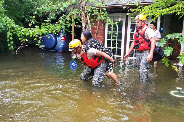 Woman being rescued from flood