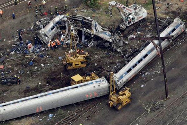 Emergency personnel work at the scene of a deadly train derailment, Wednesday, May 13, 2015, in Philadelphia. (AP Photo/Patrick Semansky)