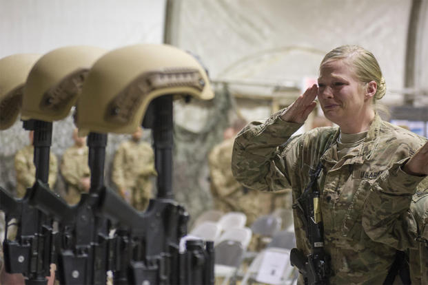 Service members from several units at Bagram Airfield, Afghanistan, pay their respects during a fallen comrade ceremony held in honor of six Airmen Dec. 23, 2015. (U.S. Air Force photo/Tech. Sgt. Robert Cloys)