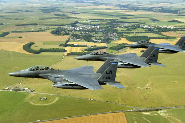 A trio of F-15E Strike Eagles from the 492nd Fighter Squadron at Royal Air Force Lakenheath, England, flies past Stonehenge.