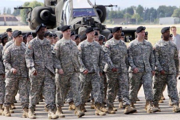The black beret, seen above, was shelved in 2011 as the official headgear for the Army Combat Uniform. Now some soldiers want the right to roll up their sleeves, particularly during summer months in warm climates. (AP)