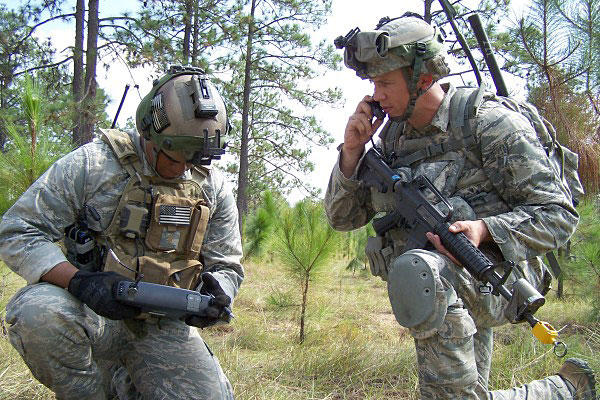 Joint terminal attack controller, 2nd Lt. Brandon Pinto, left, examines the image on a Remotely Operated Video Enhanced Receiver during Green Flag-East at Fort Polk, La. Air Force photo
