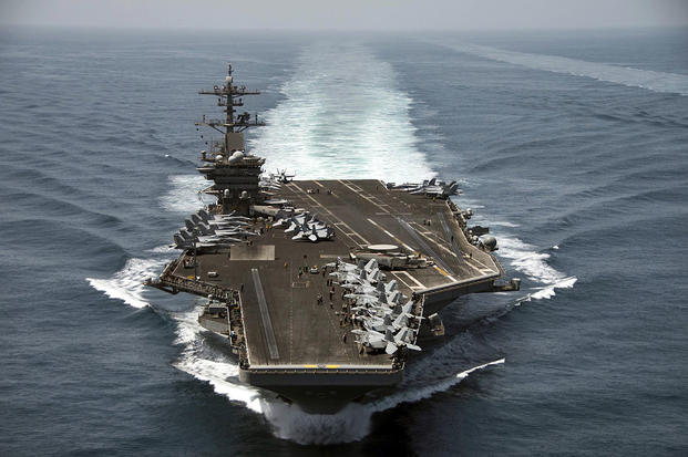 The aircraft carrier USS Theodore Roosevelt (CVN 71) operates in the Arabian Sea conducting maritime security operations.