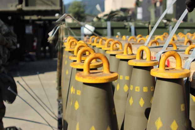 Dozens of 155mm Base Burn Dual Purpose Improved Conventional Munitions rounds wait to be loaded into M109A6 Paladin howitzers, Sept. 20, 2016 at Camp Hovey, South Korea. (Army Photo/Gabriel Jenko)