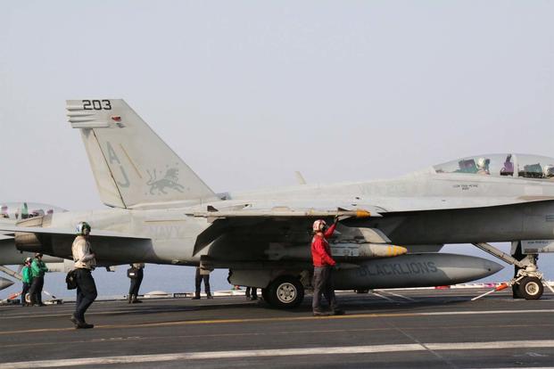 An armed F/A-18F Super Hornet attached to Strike Fighter Squadron 213 prepares to be launched from the deck of the carrier George H.W. Bush May 3 in support of Operation Inherent Resolve. (Miliary.com photo/Hope Hodge Seck)
