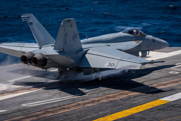 An F/A-18C Hornet assigned to the Stingers of Strike Fighter Squadron (VFA) 113, piloted by Cmdr. Erik "Popeye" Doyle, launches from the flight deck of the aircraft carrier USS Theodore Roosevelt, April 11, 2017. (U.S. Navy photo/Bill M. Sanders)