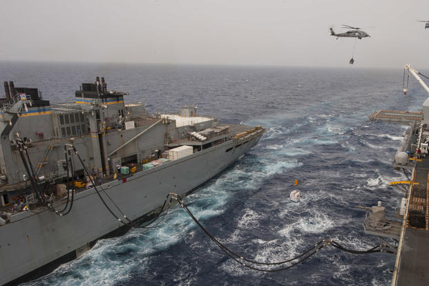 The amphibious assault ship USS Wasp (LHD 1) conducts a replenishment-at-sea alongside the fast combat support ship USNS Supply (T-AOE-6), Sept. 26, 2017. (U.S. Navy photo/Mass Communication Specialist 3rd Class Levingston Lewis)