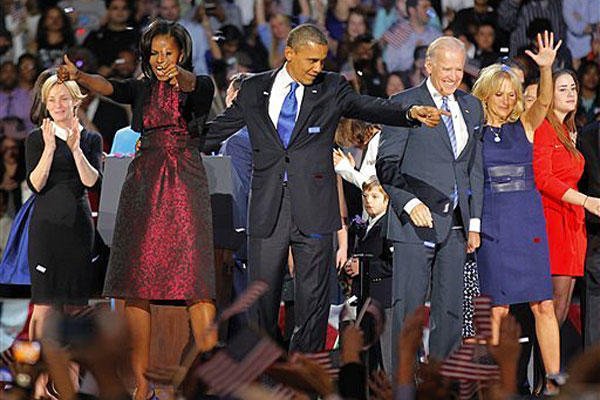 President Barack Obama , joined by his wife Michelle, Vice President Joe Biden and his spouse Jill acknowledge applause after Obama delivered his victory speech to supporters gathered in Chicago early Wednesday, Nov. 7, 2012.
