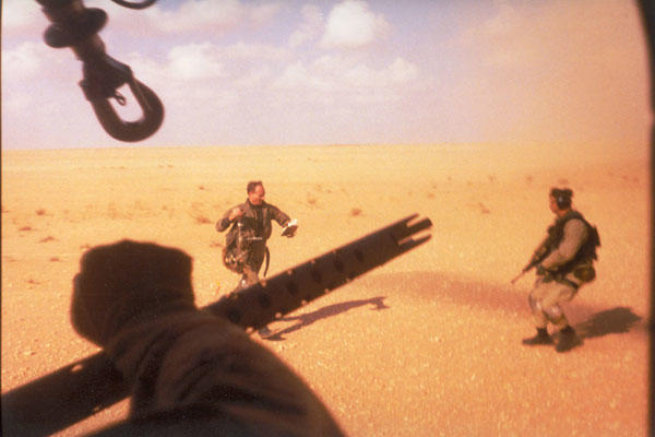 Navy Lt. Devon Jones, left, runs towards the PAVE LOW that rescued him in January 1991 during Operation Desert Storm. The 20th SOS conducted the first combat search and rescue since the Vietnam War.  Air Force photo