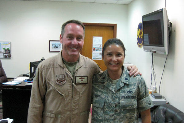 Air Force Col. Brad Hoagland, left, and Air Force Lt. Col. Elizabeth Clay, graduates of the same Ohio high school and of the U.S. Air Force Academy, pose for a photo at the 386th Air Expeditionary Wing in Southwest Asia.